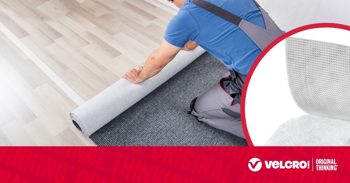 A professional floor installer working on a project.