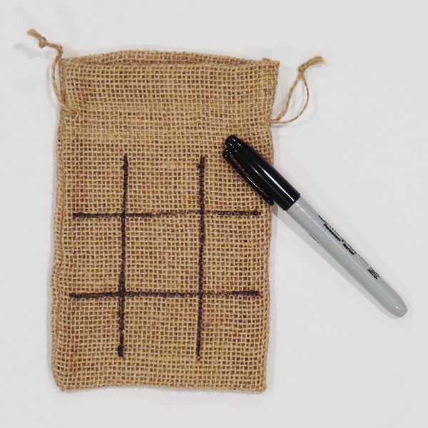 Burlap bag with tic-tac-toe- grid in black marker pen.
