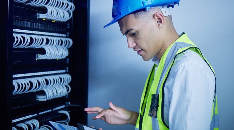 Contractor Inspecting Cable Installation