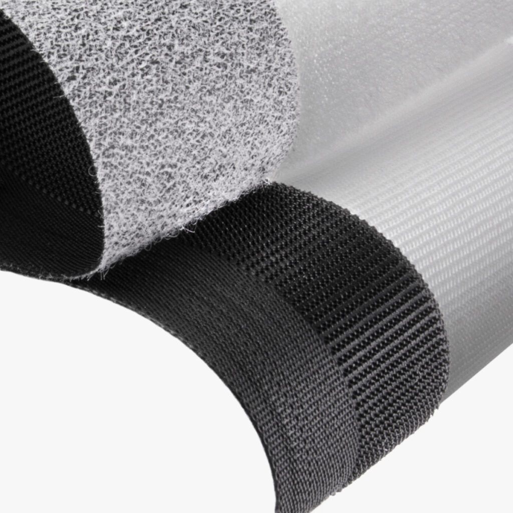 Low profile hook and loop for personal care and transportation