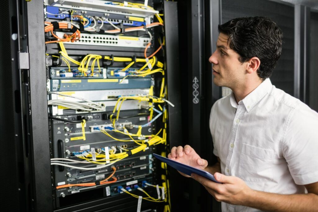 technician looking at a data center