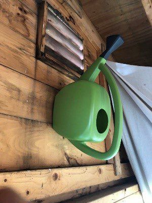 Shed Storage Ideas: Store Your Watering Can Above the Doorframe