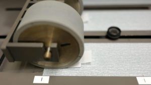 Roll down machine used for testing within diaper manufacturing